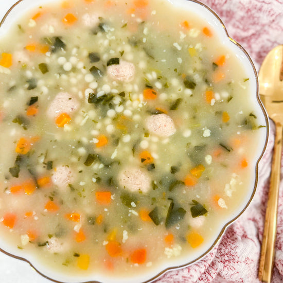 Italian Wedding Soup - Classic chicken broth with tender meatballs, pasta, carrots, celery, spinach, and parmesan