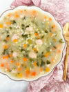 Italian Wedding Soup - Classic chicken broth with tender meatballs, pasta, carrots, celery, spinach, and parmesan