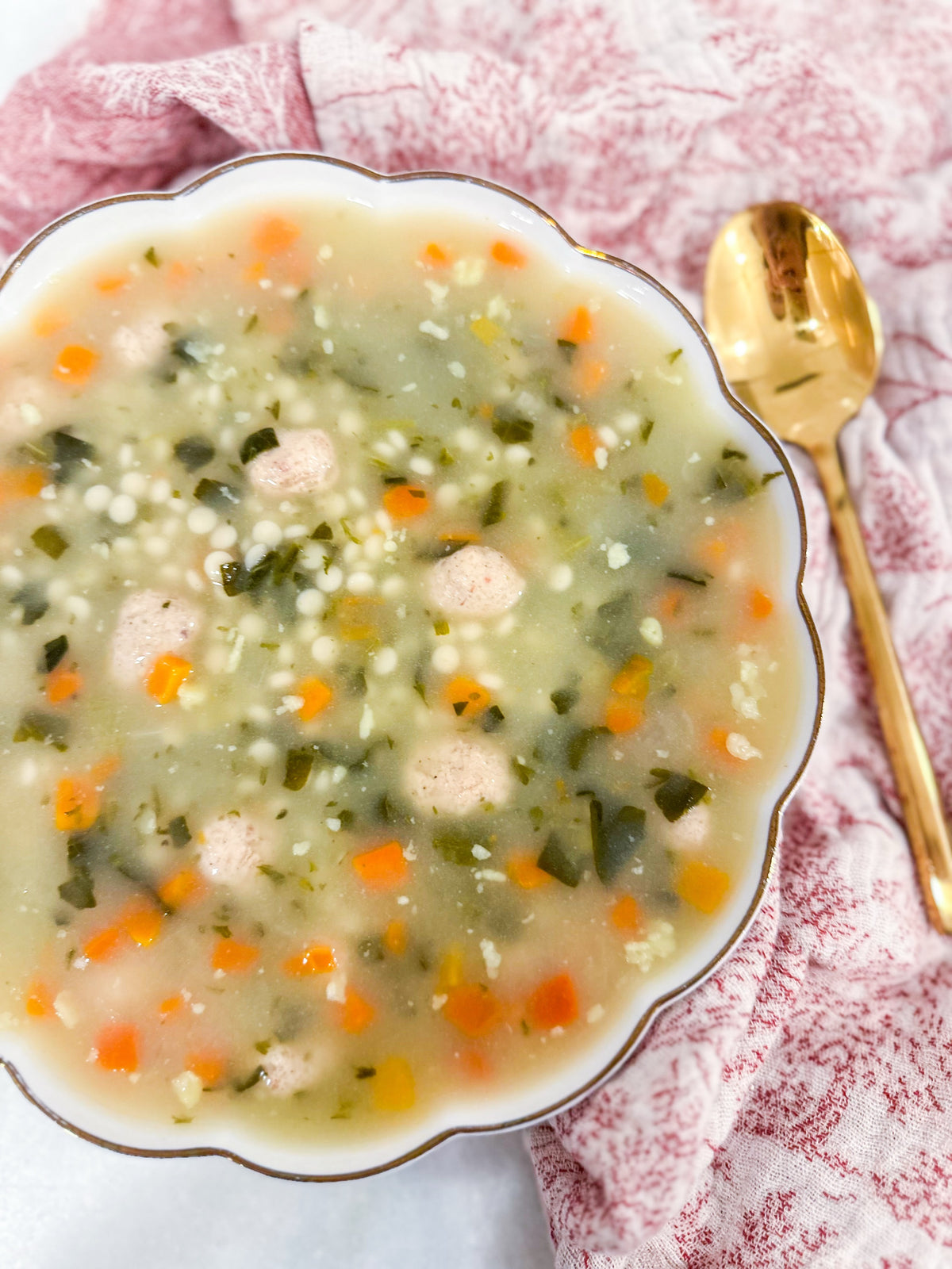 Italian Wedding Soup - Classic chicken broth with tender meatballs, pasta, carrots, celery, spinach, and parmesan