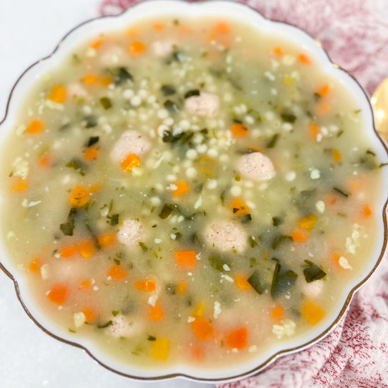Italian Wedding Soup - Classic chicken broth with tender meatballs, pasta, carrots, celery, spinach, and parmesan