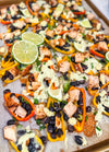 Eat Fit Pepper Nachos - Mini sweet peppers topped with chili-lime chicken, black beans, white cheddar, and green onions, finished with avocado sour cream and fresh lime