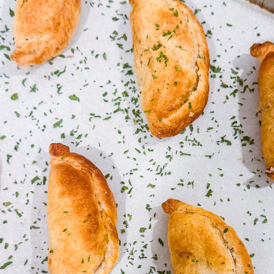 Southwest Chicken &amp; Queso Hand Pies - Flaky, golden pastry filled with southwest seasoned chicken, white queso and lime crema for dipping sauce