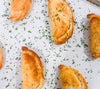 Southwest Chicken &amp; Queso Hand Pies - Flaky, golden pastry filled with southwest seasoned chicken, white queso and lime crema for dipping sauce