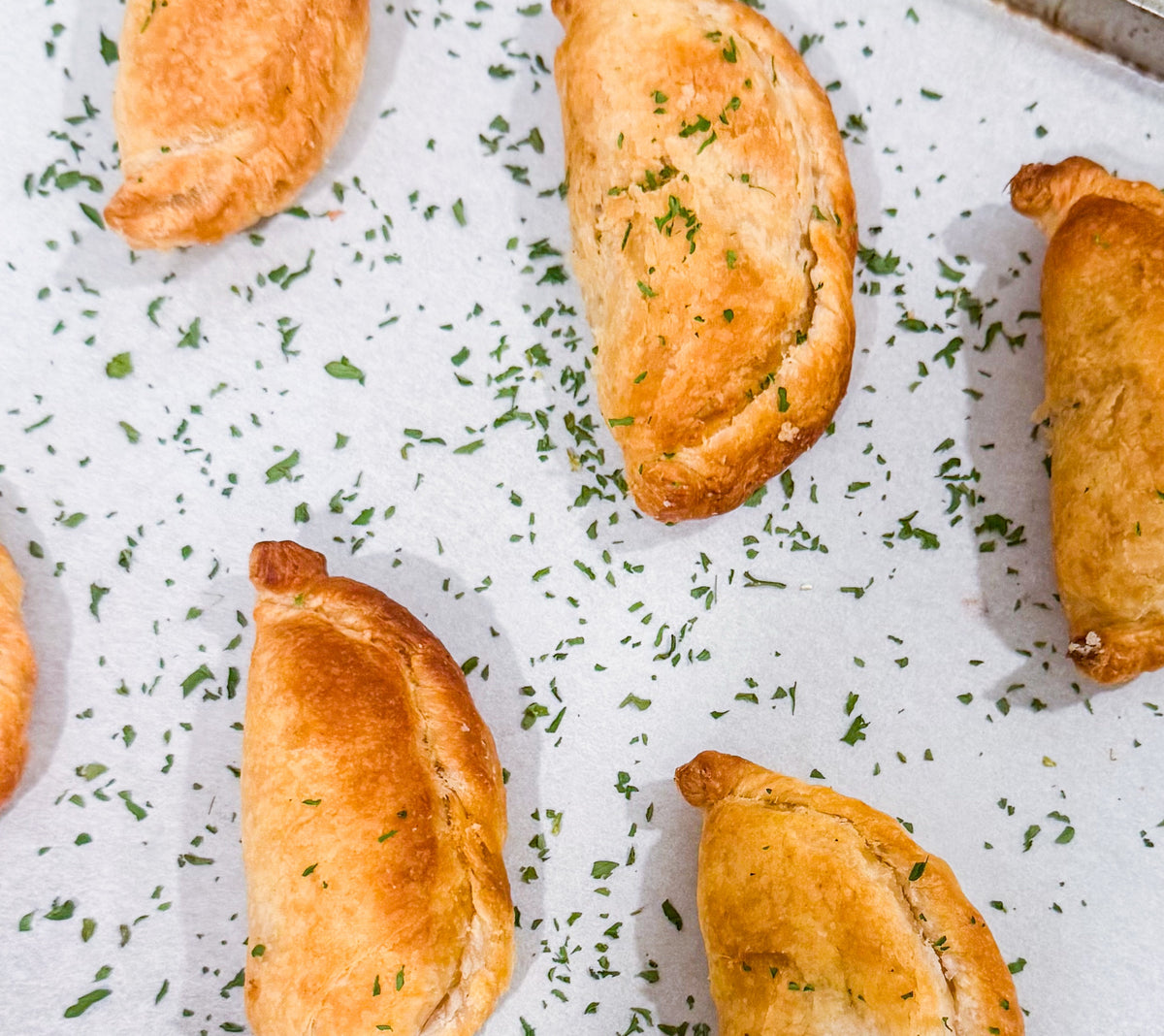 Southwest Chicken &amp; Queso Hand Pies - Flaky, golden pastry filled with southwest seasoned chicken, white queso and lime crema for dipping sauce