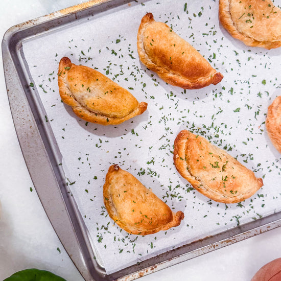Southwest Chicken &amp; Queso Hand Pies - Flaky, golden pastry filled with southwest seasoned chicken, white queso and lime crema for dipping sauce