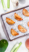 Southwest Chicken &amp; Queso Hand Pies - Flaky, golden pastry filled with southwest seasoned chicken, white queso and lime crema for dipping sauce