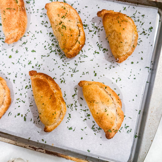 Southwest Chicken &amp; Queso Hand Pies - Flaky, golden pastry filled with southwest seasoned chicken, white queso and lime crema for dipping sauce