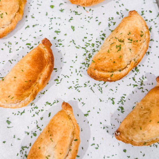 Southwest Chicken &amp; Queso Hand Pies - Flaky, golden pastry filled with southwest seasoned chicken, white queso and lime crema for dipping sauce