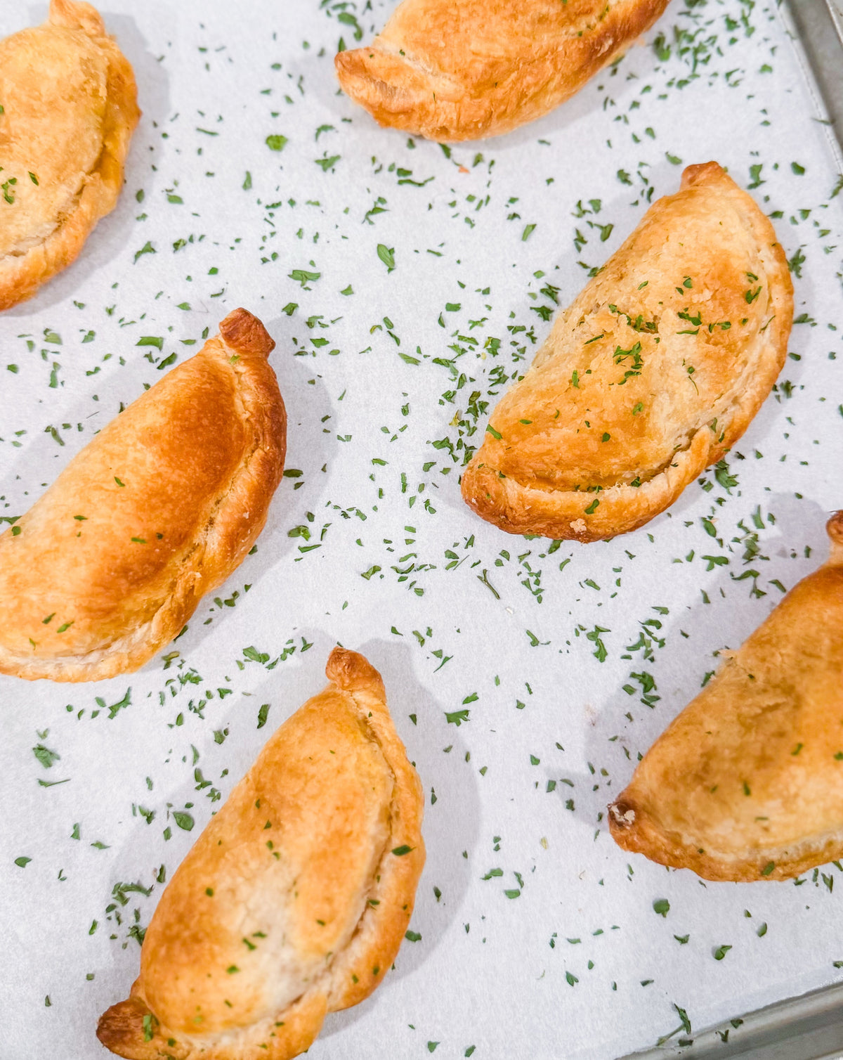 Southwest Chicken &amp; Queso Hand Pies - Flaky, golden pastry filled with southwest seasoned chicken, white queso and lime crema for dipping sauce