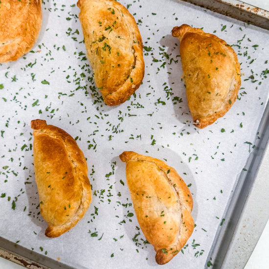 Southwest Chicken &amp; Queso Hand Pies - Flaky, golden pastry filled with southwest seasoned chicken, white queso and lime crema for dipping sauce