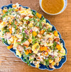Roasted Squash Pasta Salad - Roasted squash, pepitas, and goat cheese combined with grilled chicken, shallots, baby arugula, and tender tortellini, all tossed in a rich brown butter vinaigrette.