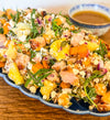 Roasted Squash Pasta Salad - Roasted squash, pepitas, and goat cheese combined with grilled chicken, shallots, baby arugula, and tender tortellini, all tossed in a rich brown butter vinaigrette.