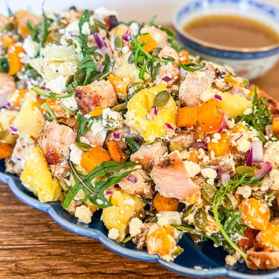 Roasted Squash Pasta Salad - Roasted squash, pepitas, and goat cheese combined with grilled chicken, shallots, baby arugula, and tender tortellini, all tossed in a rich brown butter vinaigrette.