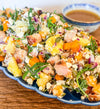 Roasted Squash Pasta Salad - Roasted squash, pepitas, and goat cheese combined with grilled chicken, shallots, baby arugula, and tender tortellini, all tossed in a rich brown butter vinaigrette.