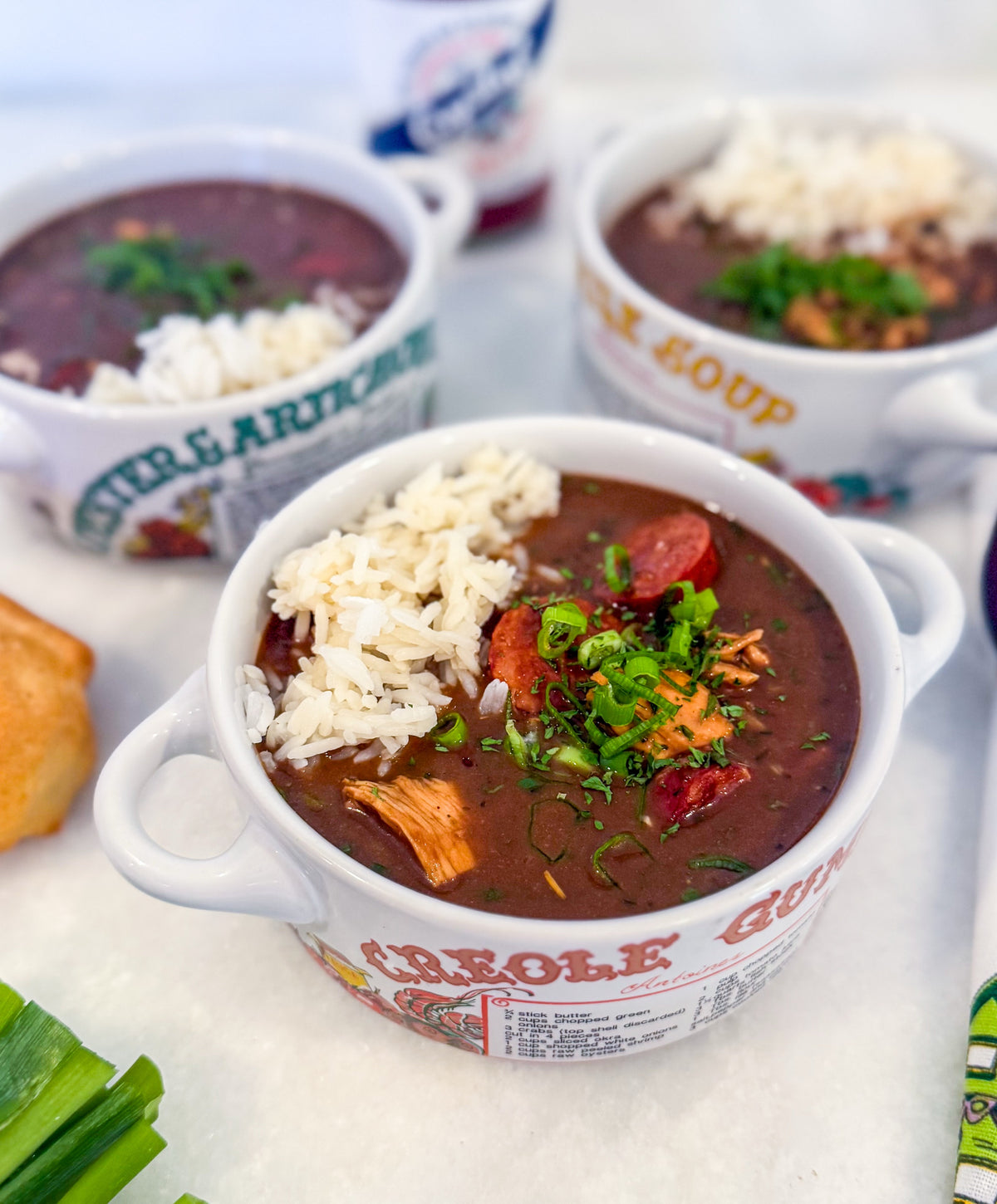 Frozen Chicken and Sausage Gumbo - Creole chicken, smoked sausage, onion, bell pepper, celery, garlic, roux, chicken stock, Creole seasoning, bay leaf, green onions