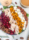 Harvest Cobb - Cider-brined grilled chicken, mixed greens, roasted butternut squash, dried cranberries, spiced pecans, goat cheese, bacon, and maple-Dijon dressing