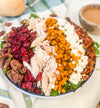 Harvest Cobb - Cider-brined grilled chicken, mixed greens, roasted butternut squash, dried cranberries, spiced pecans, goat cheese, bacon, and maple-Dijon dressing