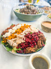 Harvest Cobb - Cider-brined grilled chicken, mixed greens, roasted butternut squash, dried cranberries, spiced pecans, goat cheese, bacon, and maple-Dijon dressing