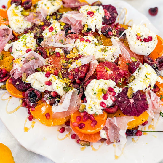 Eat Fit Seasonal Fruit &amp; Burrata Bowl - Cherries and citrus with burrata, prosciutto, pomegranate, pistachios, thyme, fresh herbs, honey, and grilled Eat Fit approved bread