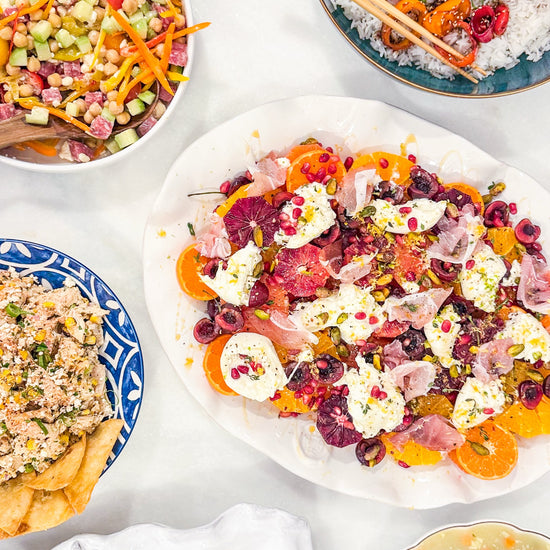 Eat Fit Seasonal Fruit &amp; Burrata Bowl - Cherries and citrus with burrata, prosciutto, pomegranate, pistachios, thyme, fresh herbs, honey, and grilled Eat Fit approved bread