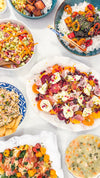 Eat Fit Seasonal Fruit &amp; Burrata Bowl - Cherries and citrus with burrata, prosciutto, pomegranate, pistachios, thyme, fresh herbs, honey, and grilled Eat Fit approved bread