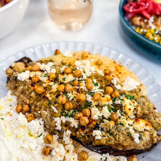Twice Baked Eggplant: Roasted Eggplant Stuffed with Lemon Hummus, Whipped Feta and Crispy Chickpeas with Grilled Bread