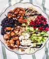 Autumn Wild Rice Bowl - Fig-butter grilled chicken, wild rice, dried cherries, pomegranate seeds, cucumbers, toasted pecans, goat cheese, blood-orange balsamic glaze
