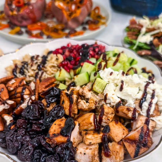 Autumn Wild Rice Bowl - Fig-butter grilled chicken, wild rice, dried cherries, pomegranate seeds, cucumbers, toasted pecans, goat cheese, blood-orange balsamic glaze